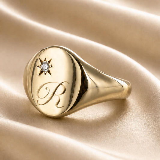 Star Jewellers Oval Diamond Signet Ring personalised with an engraved script initial
