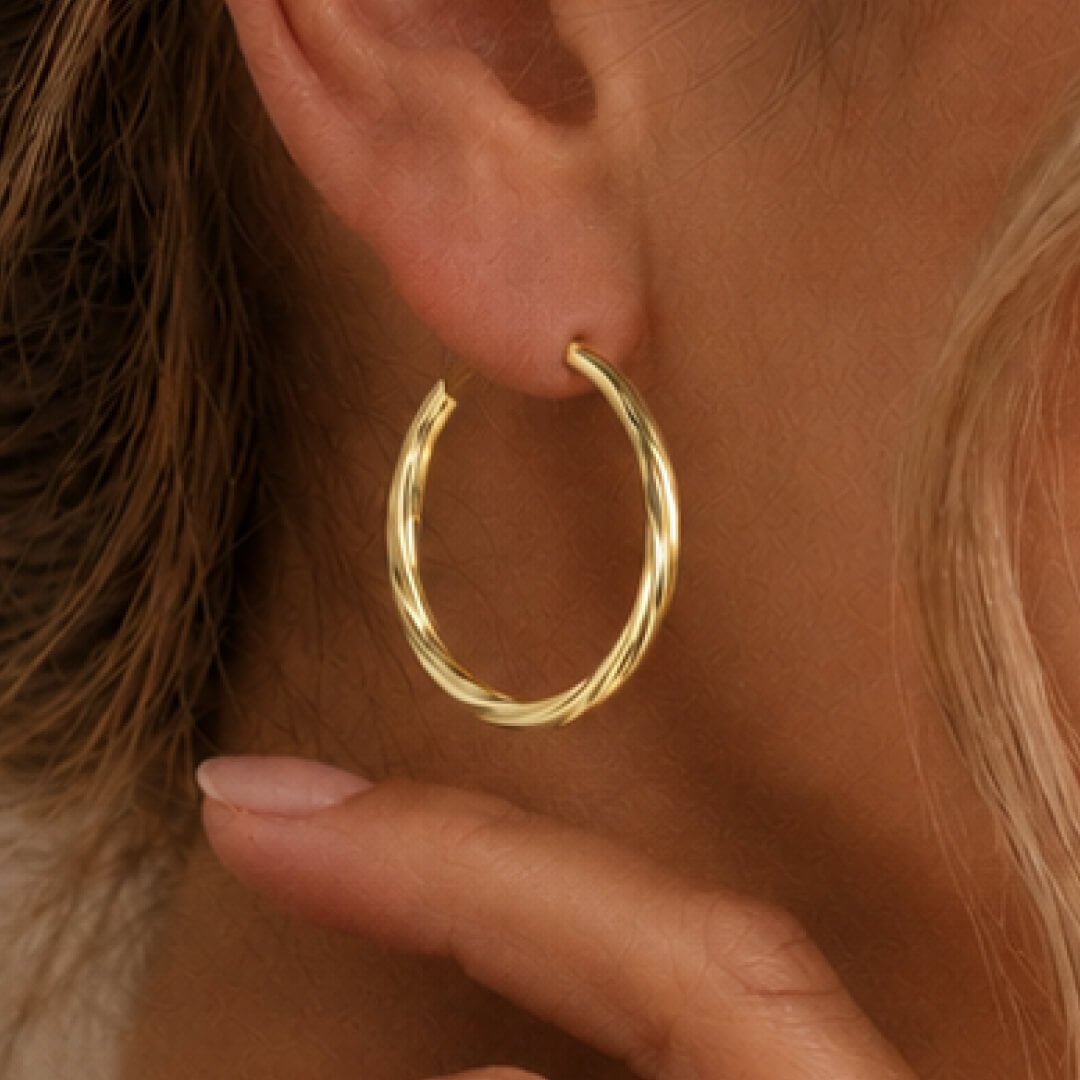 Star Jewellers Twisted Hoop Earrings in 14ct gold plating worn on the ear