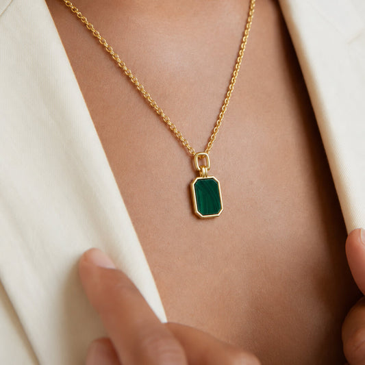 Star Jewellers Octagonal Malachite Necklace worn with a white outfit and gold chain