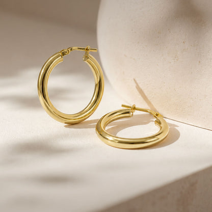 Star Jewellers Traditional Polished Hoop Earrings in 14ct gold plating displayed on a neutral surface
